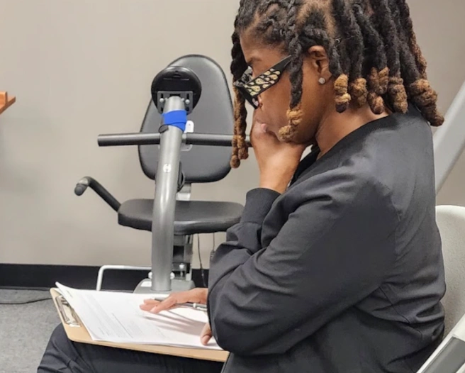 student reviewing paper work for a patient student reviewing paper work for a patient